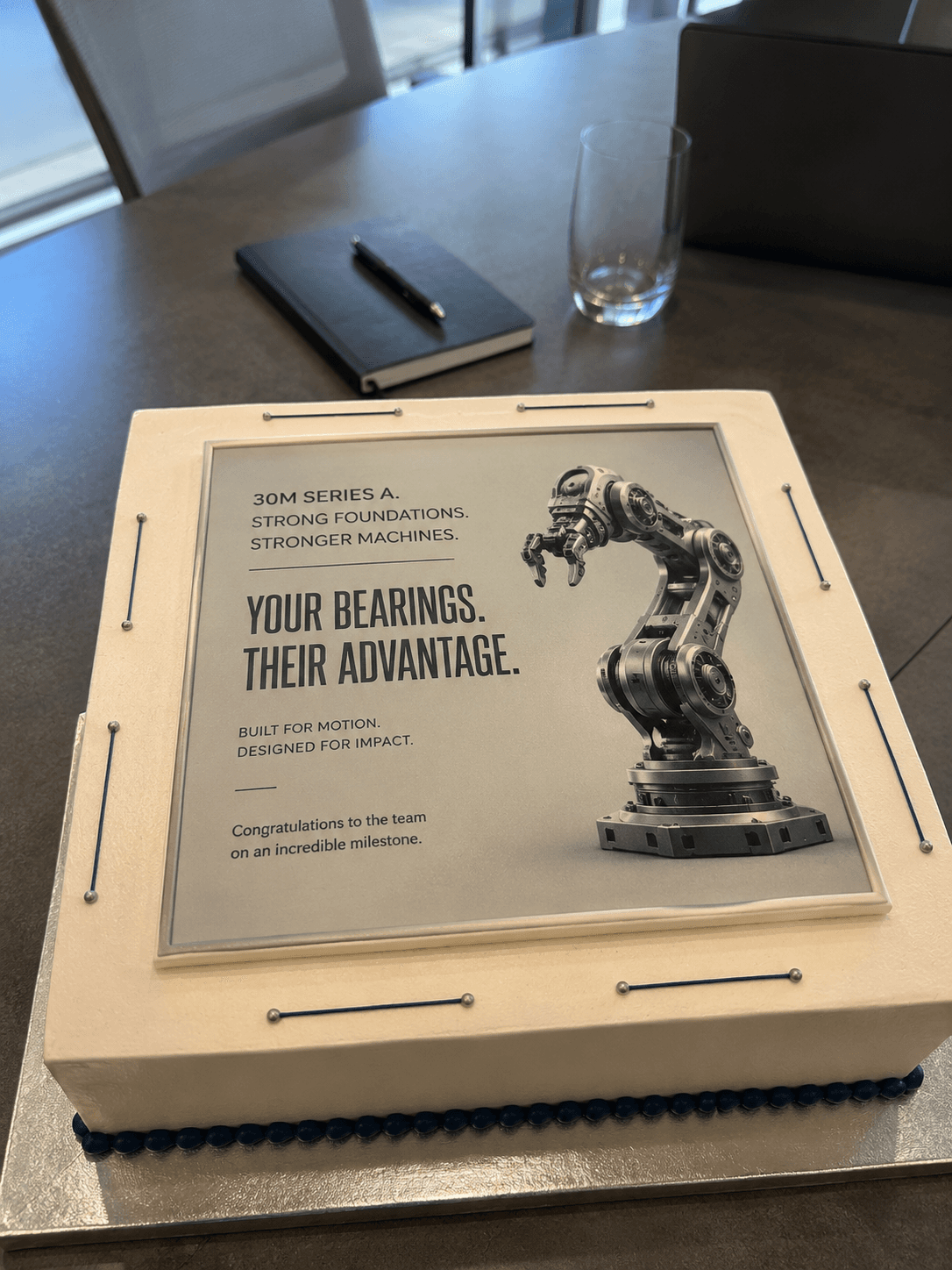 Personalized cake for a manufacturing exec celebrating a Series A